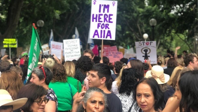 A placard that reads: I'm here for Aiia