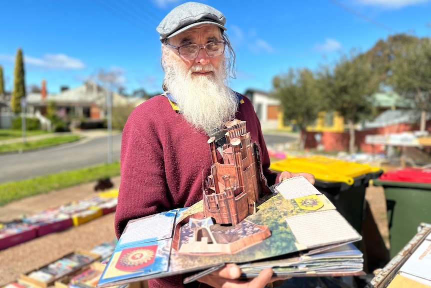 A man holding a pop-up Game of Thrones book