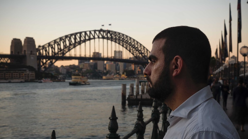 Fadi Chalouhy looking out at the water at Sydney Harbour
