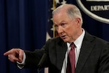 US Attorney General Jeff Sessions points a finger as he speaks at a news conference.
