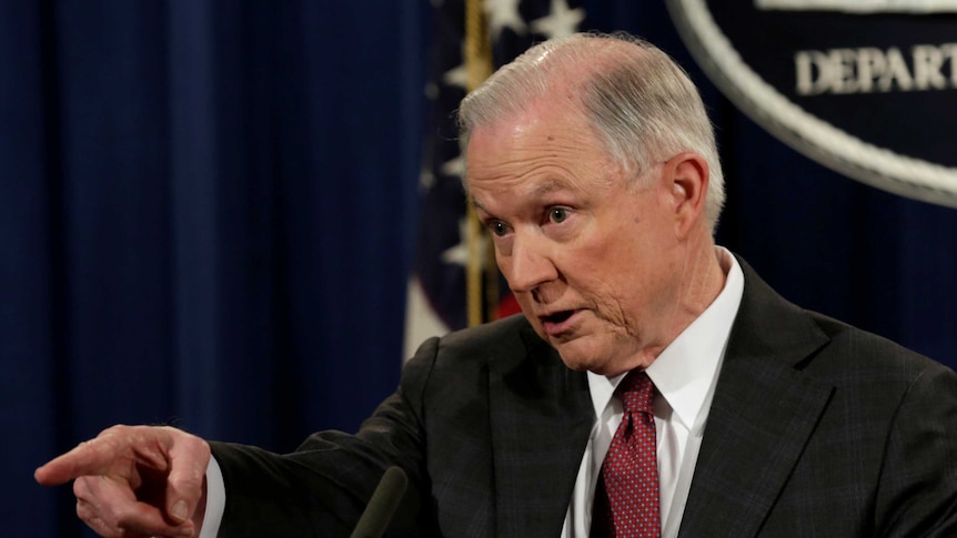 US Attorney-General Jeff Sessions points a finger as he speaks at a news conference.