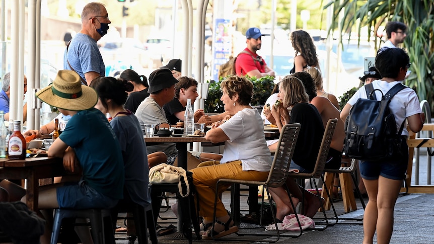 People sitting outdoors at a cafe