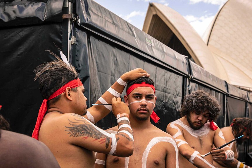 Colour photo of Nunukul Yuggera dancers getting ready backstage at Dance Rites 2018 at Sydney Opera House.