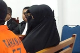 Dian Yulia Novi sits in court in Jakarta