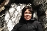 Australian production designer Deborah Riley sits on the Dragonstone Throne from Game of Thrones