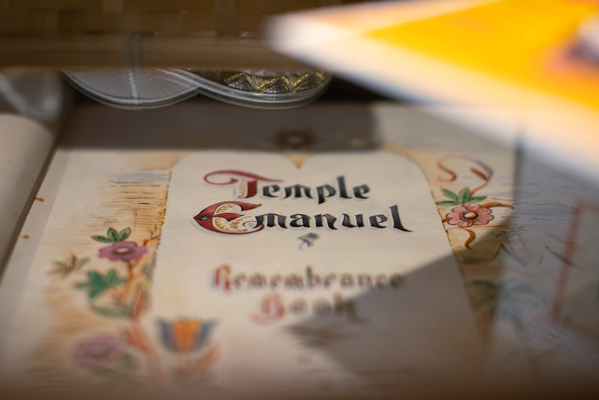 A Remembrance Book at the Emanuel Synagogue with decorative text.