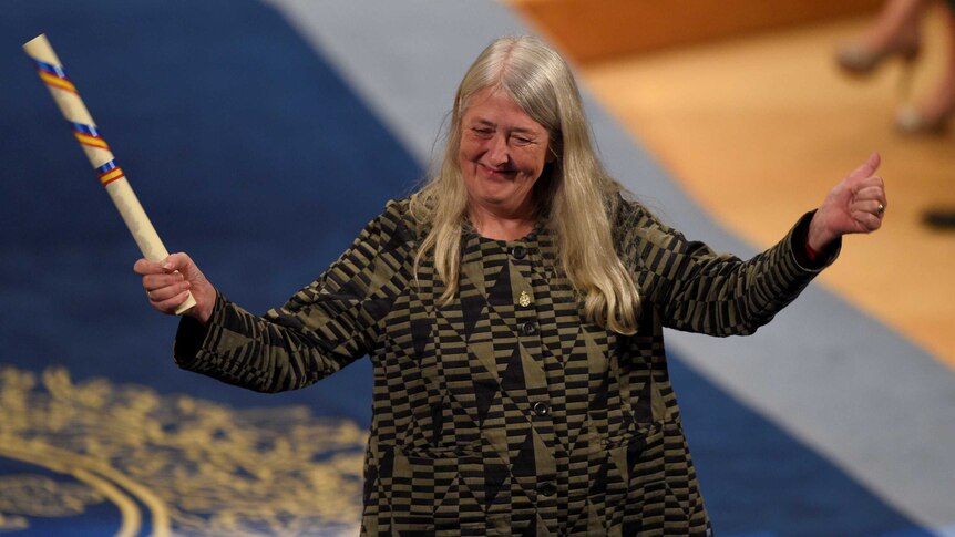 British classical scholar Mary Beard acknowledges applause after receiving award.