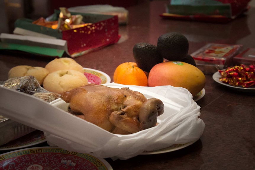 Roast duck and fruits on the temple alter