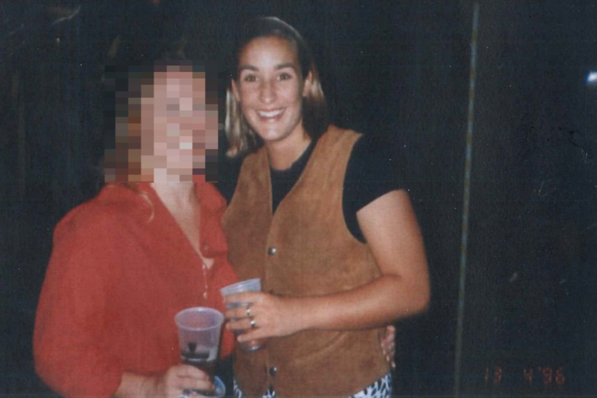 An photo of two young woman, with the one on the left blurred and Keli Lane smiling.