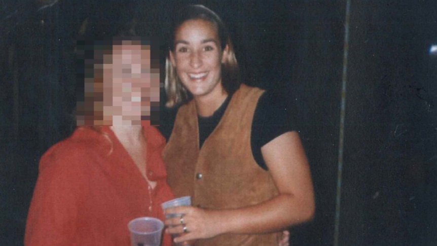 An photo of two young woman, with the one on the left blurred and Keli Lane smiling.