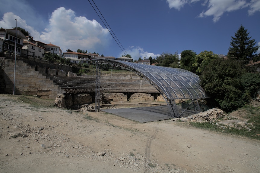 An ancient amphitheatre with a plastic covering