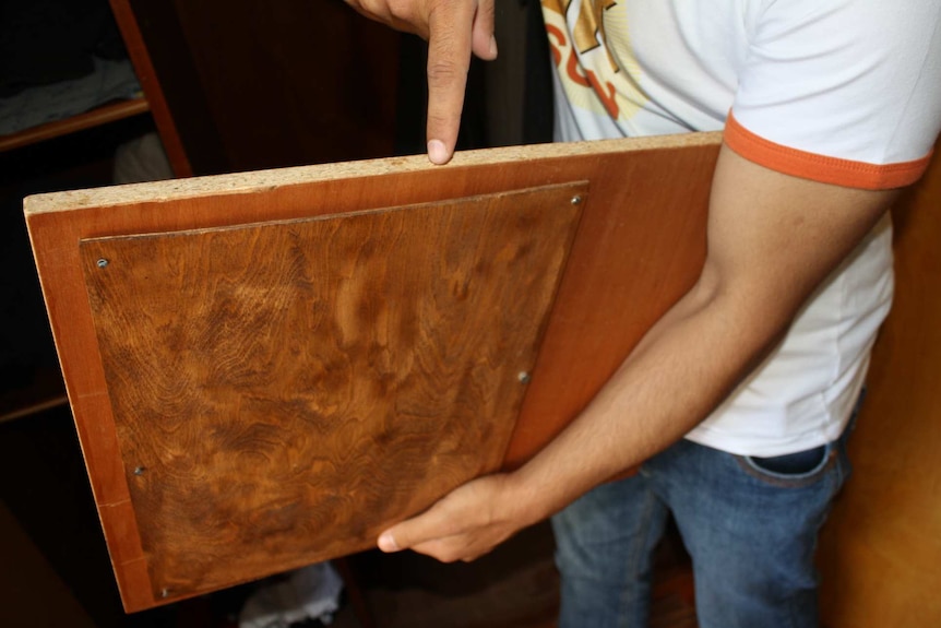 A hidden compartment in a wardrobe that contained 50,000 euros and a bank book.