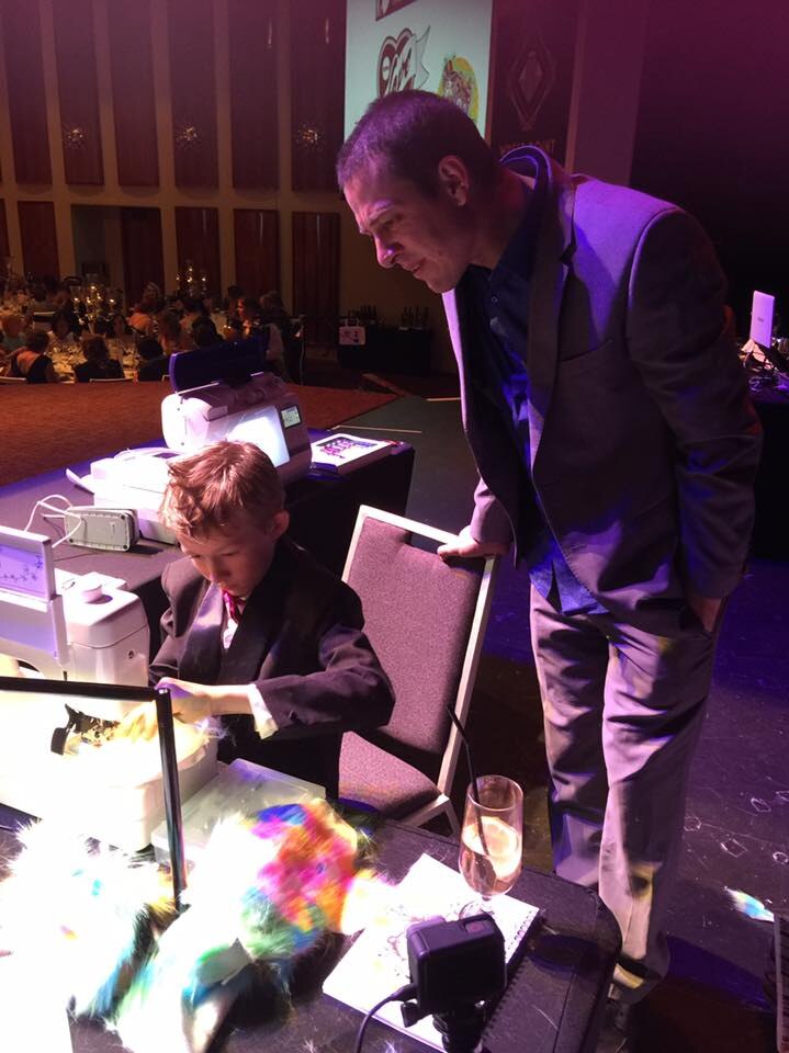 Campbell sewing on stage