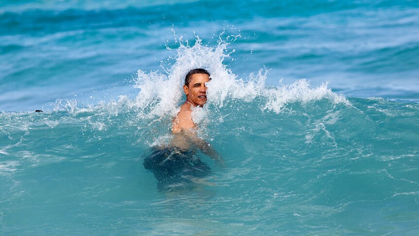 President Barack Obama hit by a wave in Hawaii