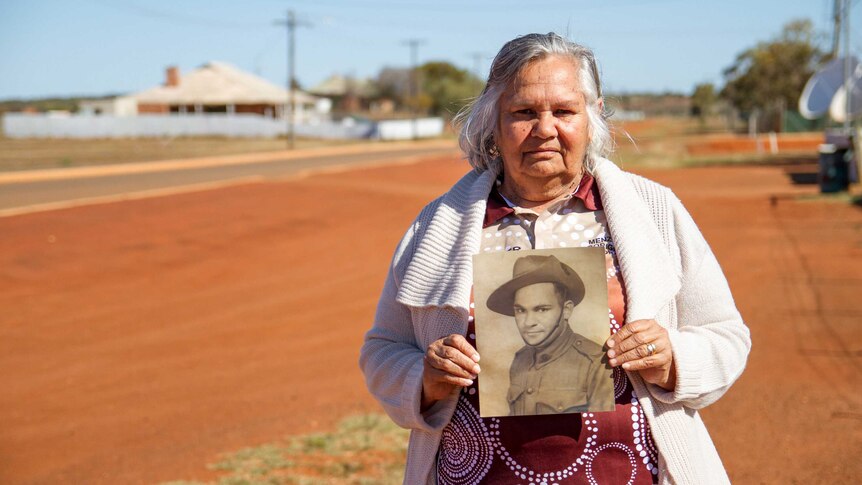 Joan Tucker, standing on a quiet street of her home town of Menzies in the WA Goldfields.