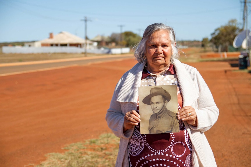 Joan Tucker, standing on a quiet street of her home town of Menzies in the WA Goldfields.