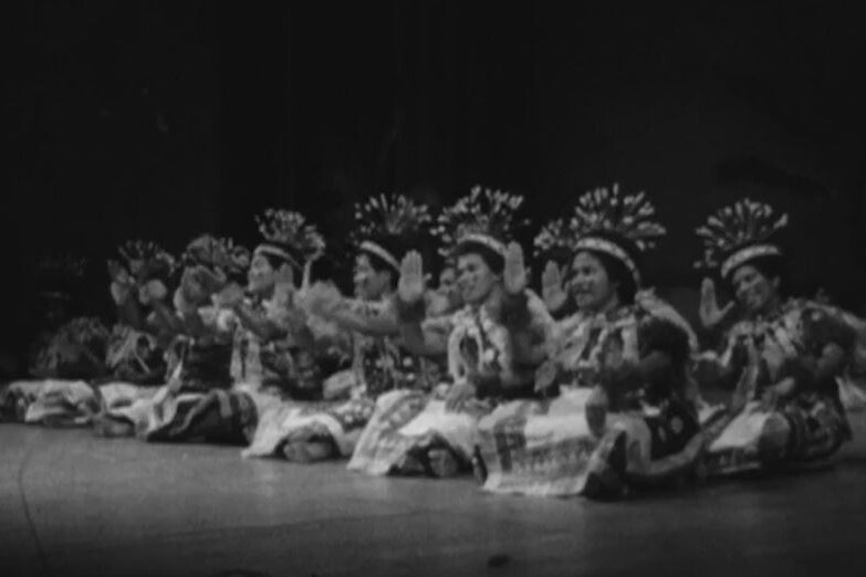 A group of fijian dancers on stage