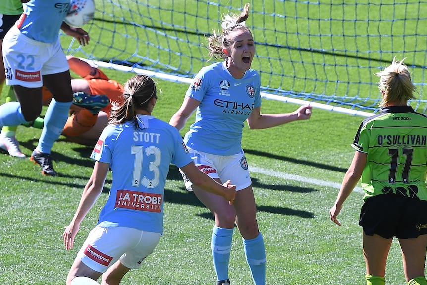 Rhali Dobson reacts with joy after scoring a goal 