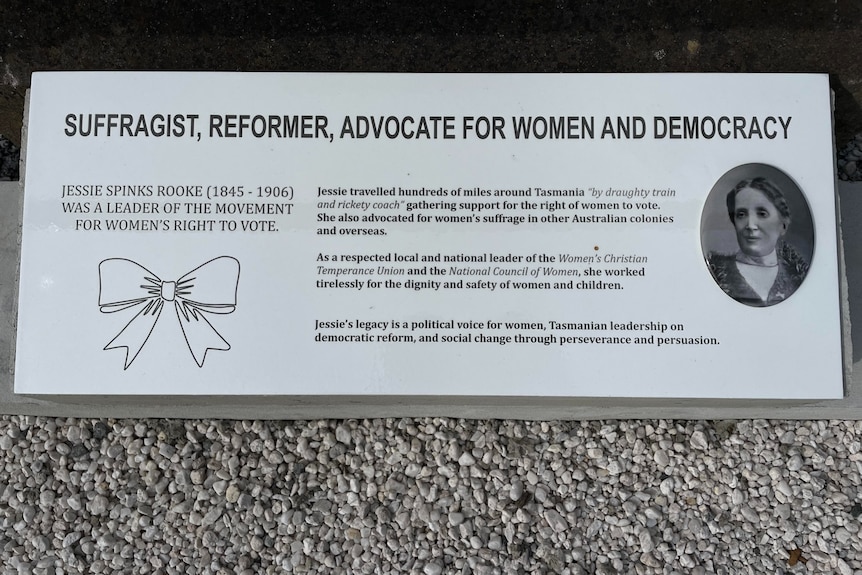 A white plaque a photo of Rooke. The text describes Rooke as a 'suffragist, reformer, advocate for women and democracy'.