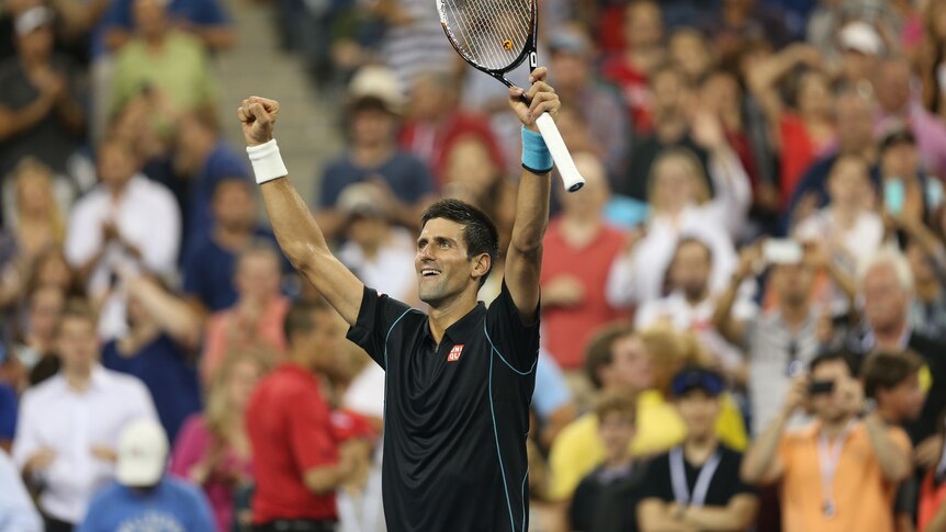 Novak Djokovic of Serbia waves to the crowd after his victory over Joao Sousa of Portugal.