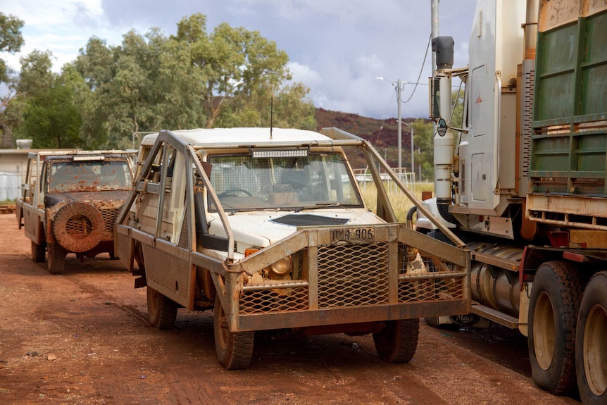 Camel mustering utes and semi-trailers parked up Blackstone in the Ngaanyatjarra Land.