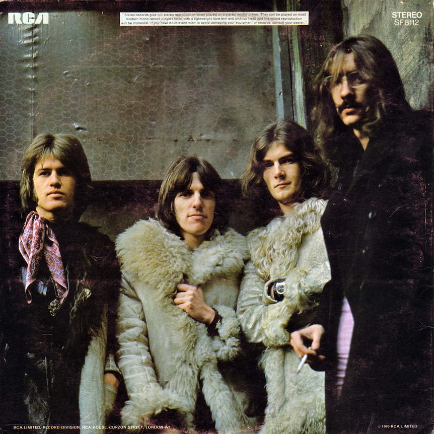 The cover sleeve of Fynn McCool's album with a group shot of band members