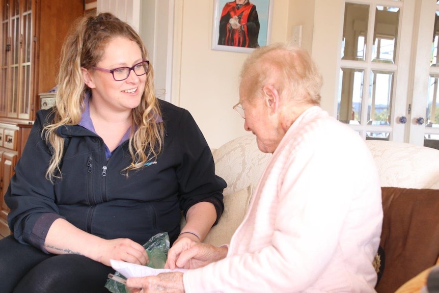 Joan Webb talks with an Anglicare support worker