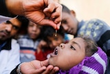 A little girl receives her vitamins in Yemen