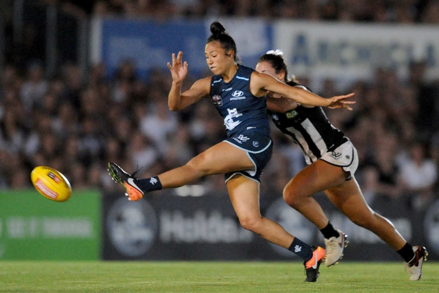 Darcy Vescio extends her leg out straight in front, just after a kick