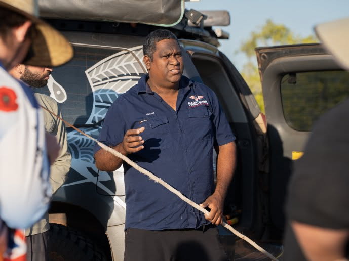 A man in a navy shirt.