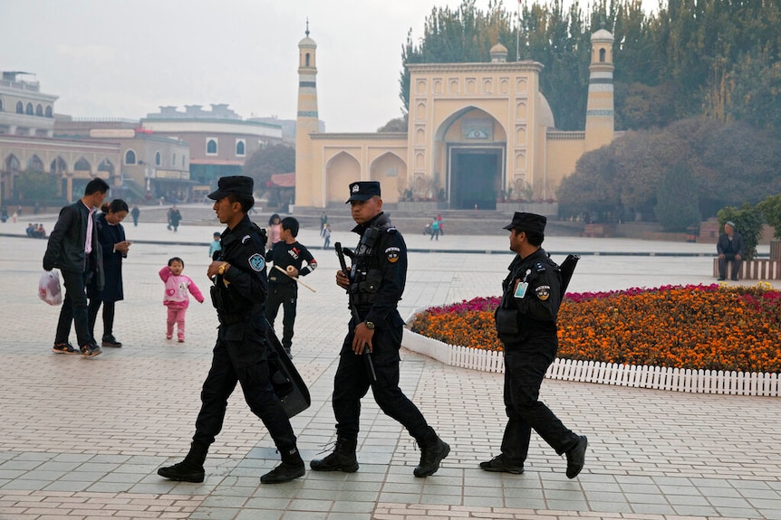 Photo of Chinese military patrolling near a mosque in China's Xinjang region.
