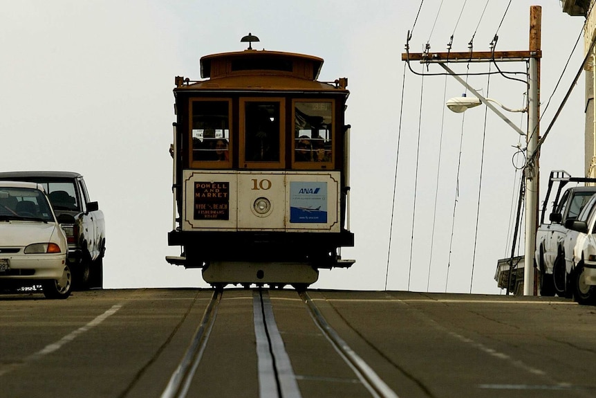 A 'trolley' or tram on tracks on a road.