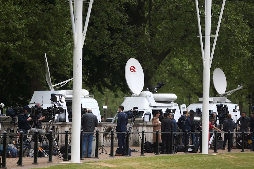 Television journalists report from outside Buckingham Palace in London, Britain, on May 4, 2017.