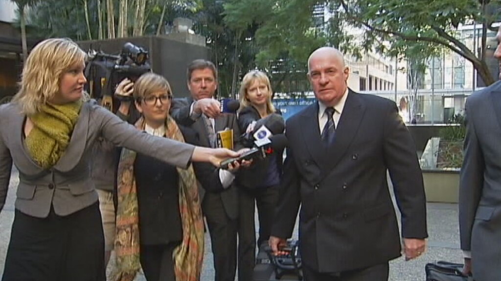 Archival shot of Gordon Nutall surrounded by a press pack