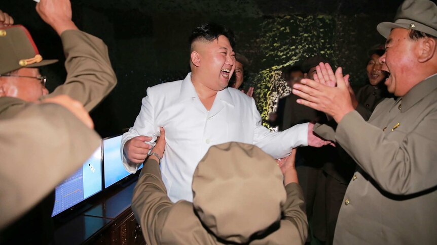 North Korean leader Kim Jong-Un inspects a ballistic missile test-fire