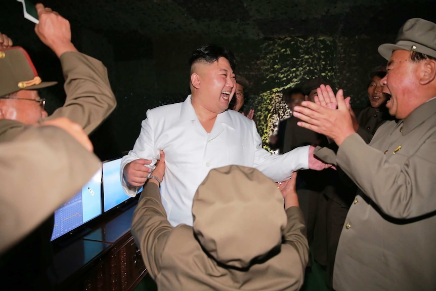North Korean leader Kim Jong-Un inspects a ballistic missile test-fire