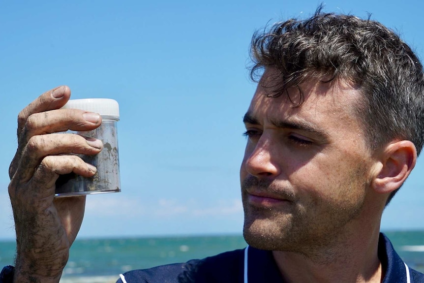 Peter Macreadie with a sediment sample.