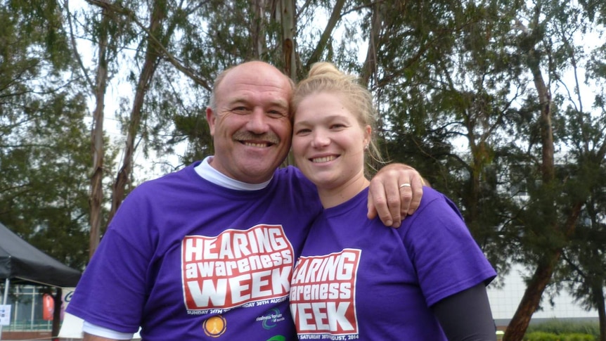 Wally Lewis and his daughter Jamie-Lee Lewis before the silent touch footy match in Canberra for the 2014 Hearing Awareness Week.