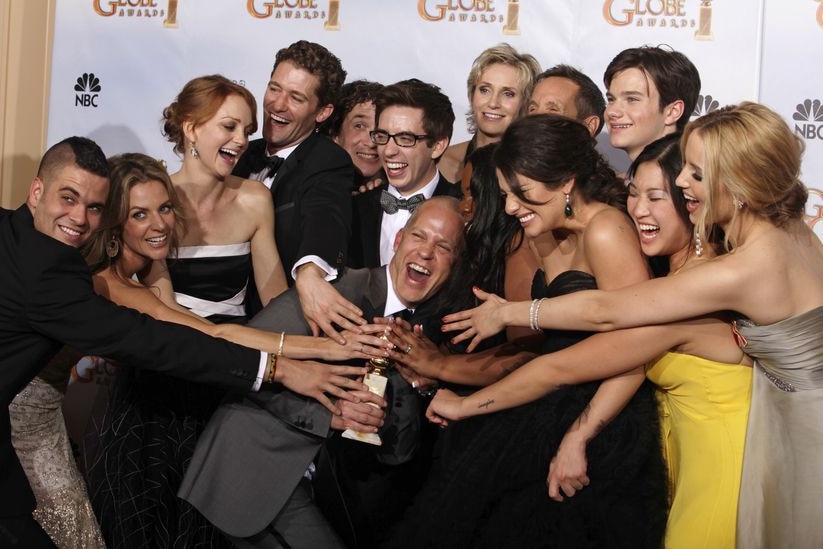 Glee creator Ryan Murphy (centre) and the cast celebrate