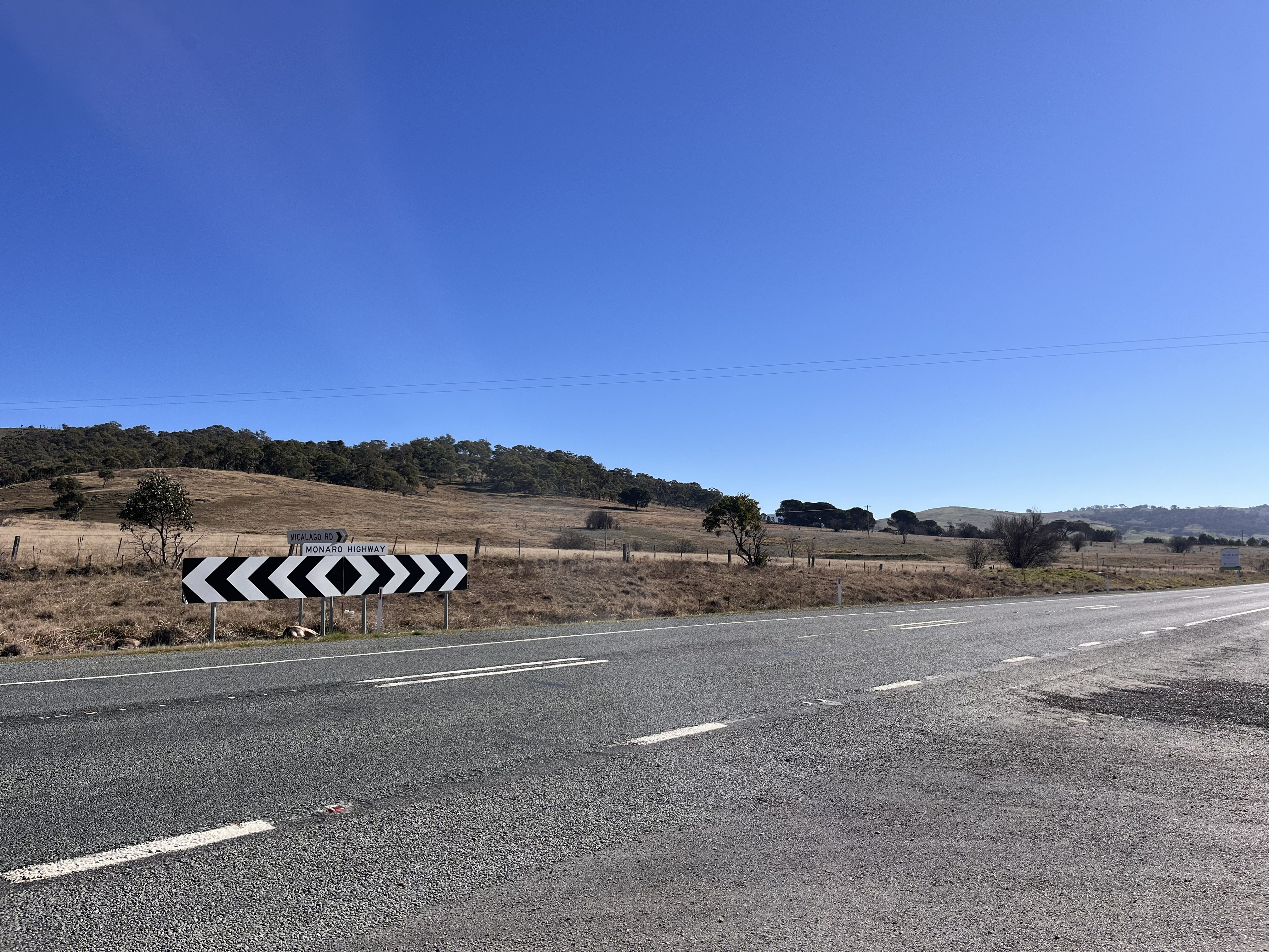 A highway with a sign saying Monaro Highway.