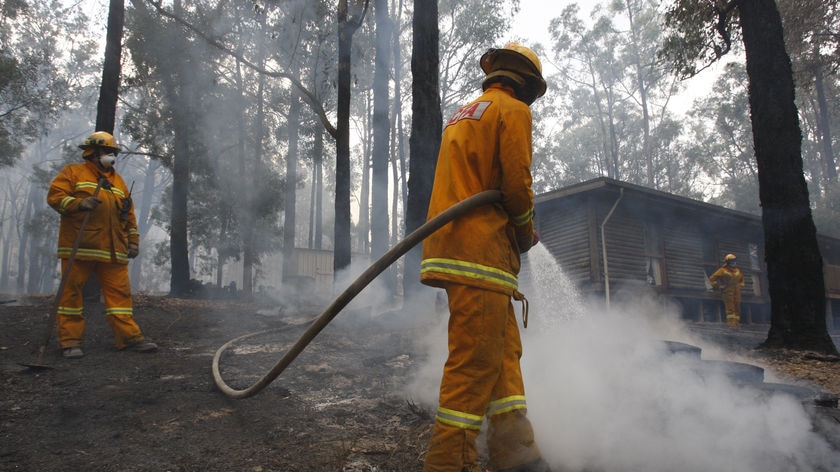 Still burning: Crews are building fire breaks in high-risk areas, including Healesville.