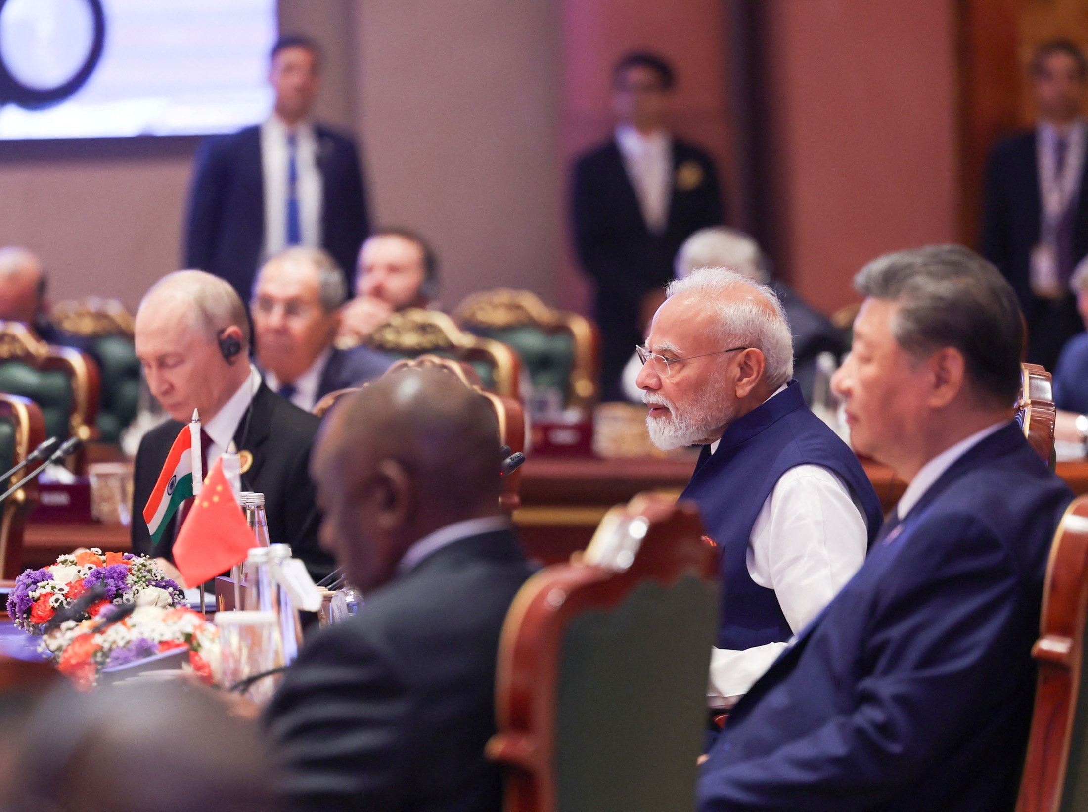 Narendra Modi speaks at confernence as XI Jinping listens in seminar room