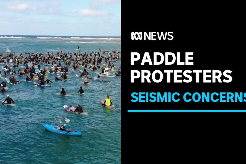 Paddle Protesters, Seismic Concerns: Hundreds of protesters sitting on surfboards in the water.
