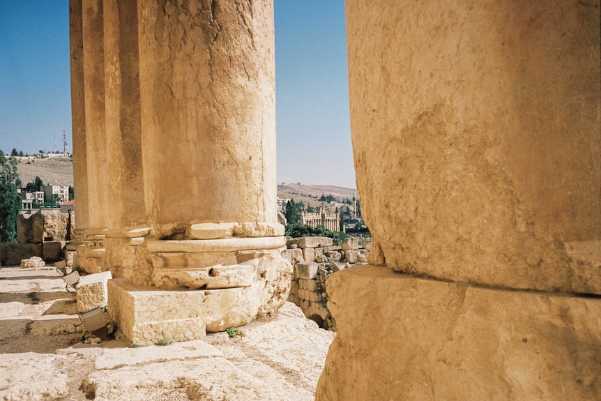 A photograph or large pillars from the Roman ruins at Baalbek, Thom Mitchell visited these on his holiday.