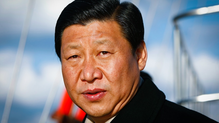 A head and shoulders photo of Xi Jinping in a black coat. 