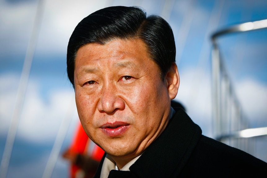 A head and shoulders photo of Xi Jinping in a black coat. 