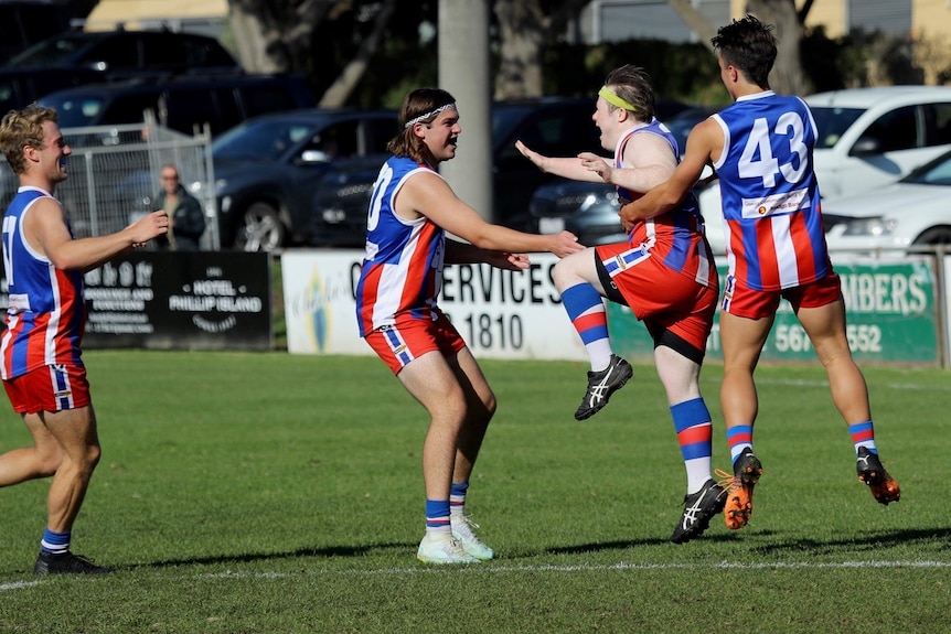 game of football for players with an intellectual disability. Team wearing blue red and white jumpers