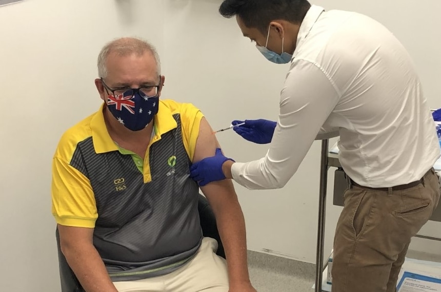 Prime Minister Scott Morrison gets an injection of the Pfizer COVID-19 vaccine in his left arm.