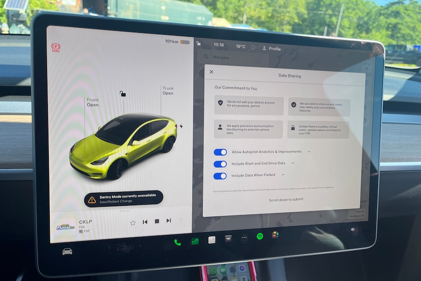 The display screen in a Tesla asking for Data Sharing permission and showing the controls for the frunk and trunk.