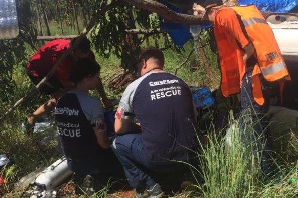 CareFlight medical staff attend to a tourist hurt in a Stuart Highway crash on Saturday, 20 February.